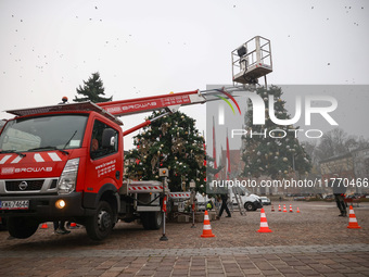 Workers are erecting a Christmas Tree at the Podgorski Square in Krakow, Poland on November 12th, 2024. (