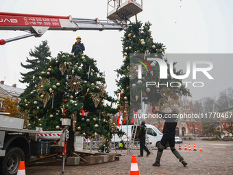 Workers are erecting a Christmas Tree at the Podgorski Square in Krakow, Poland on November 12th, 2024. (