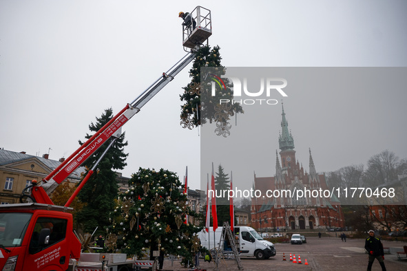 Workers are erecting a Christmas Tree at the Podgorski Square in Krakow, Poland on November 12th, 2024. 