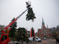 Workers are erecting a Christmas Tree at the Podgorski Square in Krakow, Poland on November 12th, 2024. (