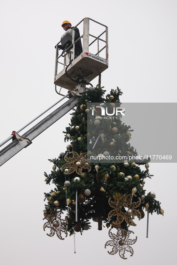 Workers are erecting a Christmas Tree at the Podgorski Square in Krakow, Poland on November 12th, 2024. 