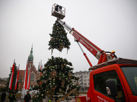 Workers are erecting a Christmas Tree at the Podgorski Square in Krakow, Poland on November 12th, 2024. (