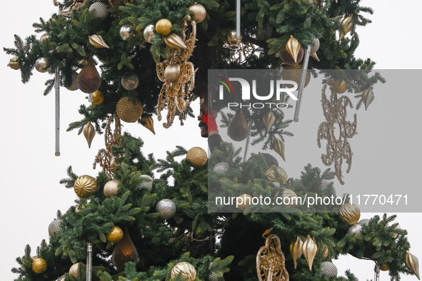 Workers are erecting a Christmas Tree at the Podgorski Square in Krakow, Poland on November 12th, 2024. 