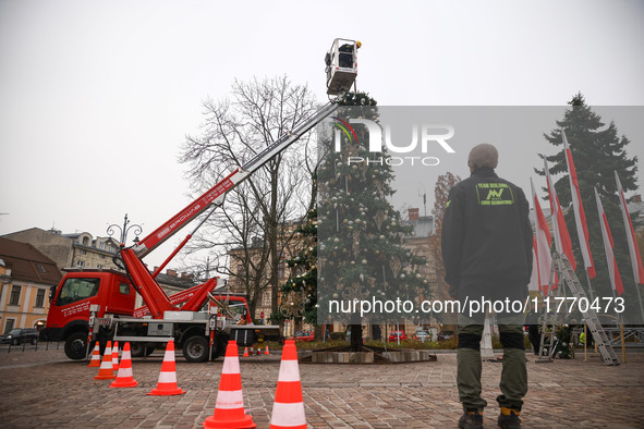 Workers are erecting a Christmas Tree at the Podgorski Square in Krakow, Poland on November 12th, 2024. 