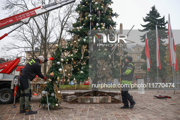 Workers are erecting a Christmas Tree at the Podgorski Square in Krakow, Poland on November 12th, 2024. 