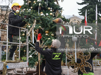 Workers are erecting a Christmas Tree at the Podgorski Square in Krakow, Poland on November 12th, 2024. (