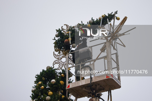 Workers are erecting a Christmas Tree at the Podgorski Square in Krakow, Poland on November 12th, 2024. 