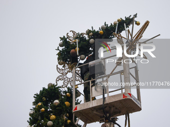 Workers are erecting a Christmas Tree at the Podgorski Square in Krakow, Poland on November 12th, 2024. (