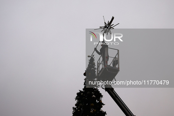 Workers are erecting a Christmas Tree at the Podgorski Square in Krakow, Poland on November 12th, 2024. 