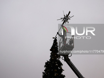 Workers are erecting a Christmas Tree at the Podgorski Square in Krakow, Poland on November 12th, 2024. (