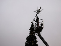 Workers are erecting a Christmas Tree at the Podgorski Square in Krakow, Poland on November 12th, 2024. (