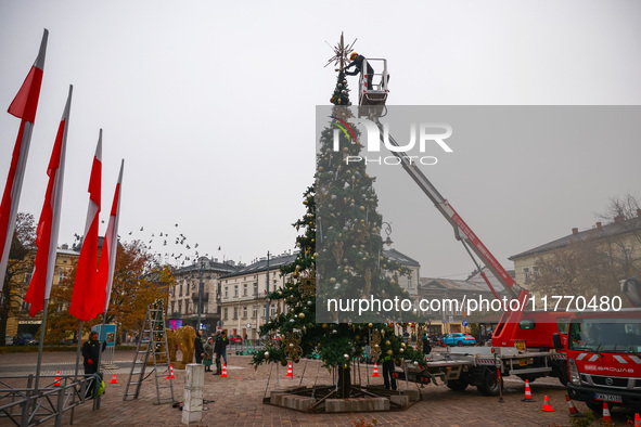 Workers are erecting a Christmas Tree at the Podgorski Square in Krakow, Poland on November 12th, 2024. 