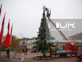 Workers are erecting a Christmas Tree at the Podgorski Square in Krakow, Poland on November 12th, 2024. (