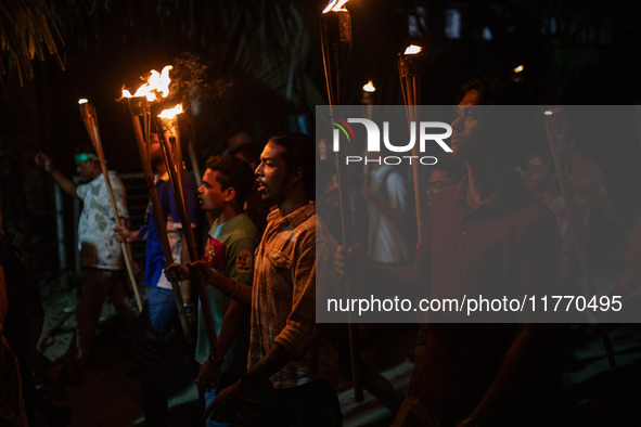 The Bangladesh Students Union holds a torch procession protesting the murder of a female ready-made garment worker and demanding justice at...