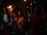 The Bangladesh Students Union holds a torch procession protesting the murder of a female ready-made garment worker and demanding justice at...