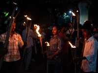 The Bangladesh Students Union holds a torch procession protesting the murder of a female ready-made garment worker and demanding justice at...