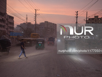 People suffer on the street due to massive dust in the air in the Shyampur area, in Dhaka, Bangladesh, on November 12, 2024. Dhaka, the over...