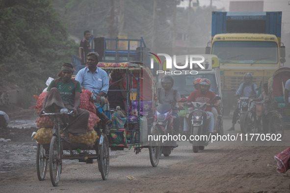 People suffer on the street due to massive dust in the air in the Shyampur area, in Dhaka, Bangladesh, on November 12, 2024. Dhaka, the over...