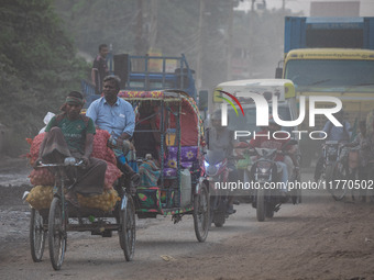 People suffer on the street due to massive dust in the air in the Shyampur area, in Dhaka, Bangladesh, on November 12, 2024. Dhaka, the over...