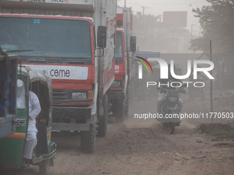 People suffer on the street due to massive dust in the air in the Shyampur area, in Dhaka, Bangladesh, on November 12, 2024. Dhaka, the over...