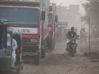 People suffer on the street due to massive dust in the air in the Shyampur area, in Dhaka, Bangladesh, on November 12, 2024. Dhaka, the over...