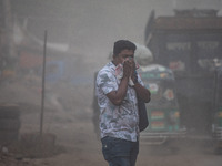 People suffer on the street due to massive dust in the air in the Shyampur area, in Dhaka, Bangladesh, on November 12, 2024. Dhaka, the over...