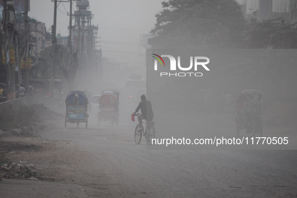 People suffer on the street due to massive dust in the air in the Shyampur area, in Dhaka, Bangladesh, on November 12, 2024. Dhaka, the over...