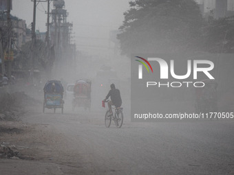 People suffer on the street due to massive dust in the air in the Shyampur area, in Dhaka, Bangladesh, on November 12, 2024. Dhaka, the over...