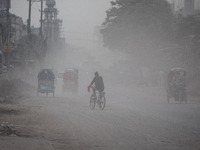 People suffer on the street due to massive dust in the air in the Shyampur area, in Dhaka, Bangladesh, on November 12, 2024. Dhaka, the over...