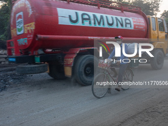 People suffer on the street due to massive dust in the air in the Shyampur area, in Dhaka, Bangladesh, on November 12, 2024. Dhaka, the over...