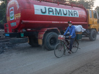 People suffer on the street due to massive dust in the air in the Shyampur area, in Dhaka, Bangladesh, on November 12, 2024. Dhaka, the over...