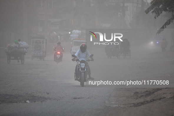 People suffer on the street due to massive dust in the air in the Shyampur area, in Dhaka, Bangladesh, on November 12, 2024. Dhaka, the over...