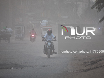 People suffer on the street due to massive dust in the air in the Shyampur area, in Dhaka, Bangladesh, on November 12, 2024. Dhaka, the over...