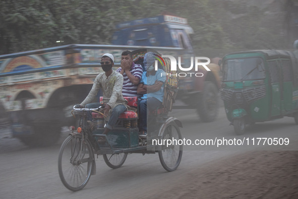 People suffer on the street due to massive dust in the air in the Shyampur area, in Dhaka, Bangladesh, on November 12, 2024. Dhaka, the over...