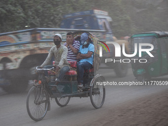 People suffer on the street due to massive dust in the air in the Shyampur area, in Dhaka, Bangladesh, on November 12, 2024. Dhaka, the over...