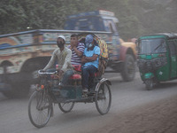 People suffer on the street due to massive dust in the air in the Shyampur area, in Dhaka, Bangladesh, on November 12, 2024. Dhaka, the over...