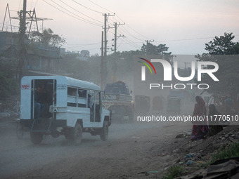 People suffer on the street due to massive dust in the air in the Shyampur area, in Dhaka, Bangladesh, on November 12, 2024. Dhaka, the over...