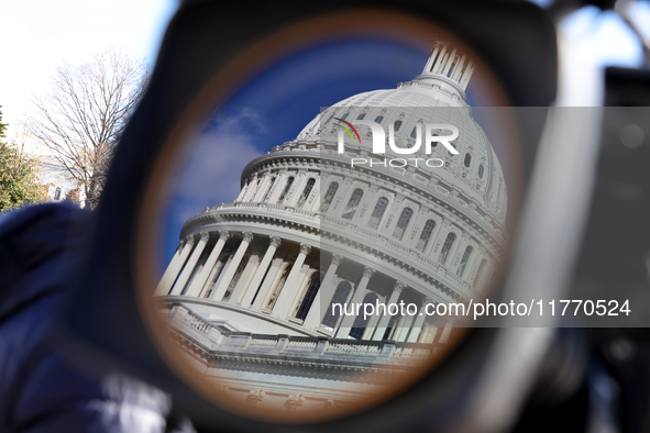 The dome of the U.S. Capitol buildling is seen reflected in a video camera lens before a GOP press conference on the steps of the U.S. Capit...