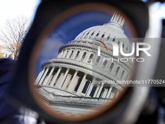 The dome of the U.S. Capitol buildling is seen reflected in a video camera lens before a GOP press conference on the steps of the U.S. Capit...