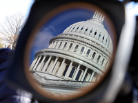 The dome of the U.S. Capitol buildling is seen reflected in a video camera lens before a GOP press conference on the steps of the U.S. Capit...