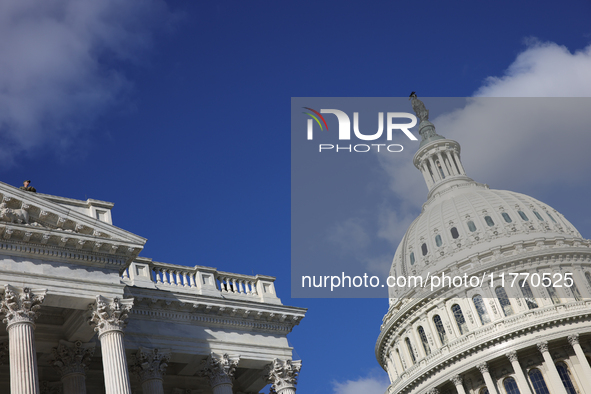 A law enforcement officer watches from the rooftop of the U.S. Capitol in Washington, D.C. on November 12, 2024, prior to a GOP press confer...