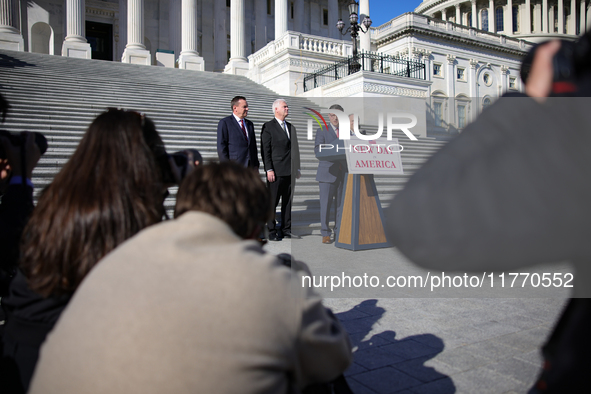 Members of the press take photos as House Speaker Mike Johnson (R-LA), flanked by Chair of the National Republican Congressional Committee R...