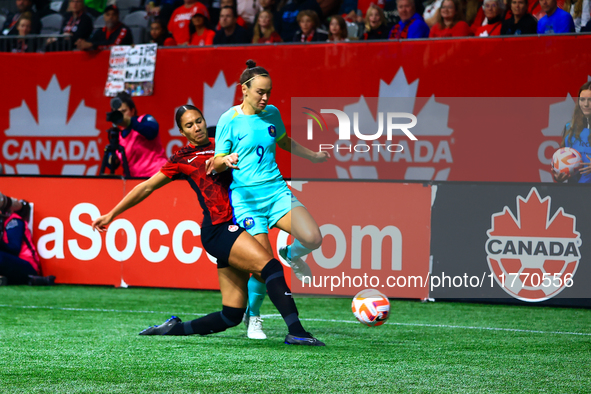 C. Foord #9 is challenged by J. Rose #21 during an international friendly match between Canada and Australia at BC Place in Vancouver, Canad...