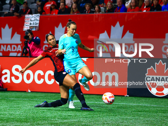 C. Foord #9 is challenged by J. Rose #21 during an international friendly match between Canada and Australia at BC Place in Vancouver, Canad...