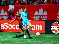 C. Foord #9 is challenged by J. Rose #21 during an international friendly match between Canada and Australia at BC Place in Vancouver, Canad...