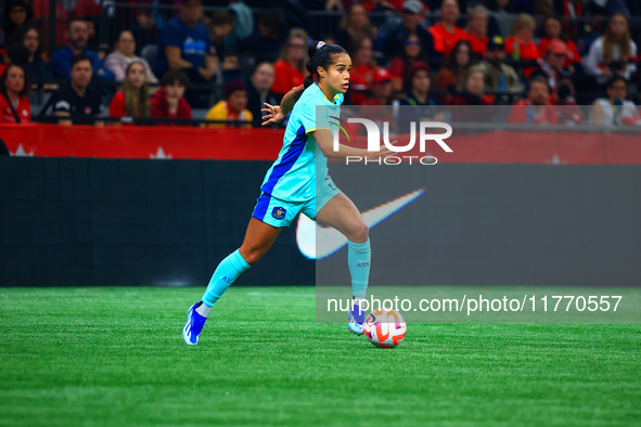 M. Fowler #11 carries the ball during the International Friendly Match between Canada and Australia in Vancouver, Canada, on December 5, 202...