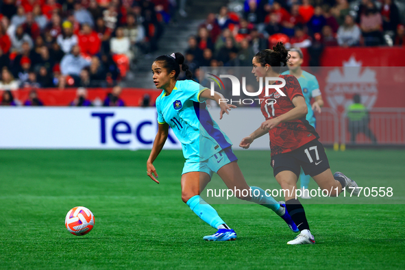 M. Fowler #11 carries the ball while guarded by J. Fleming #17 during the International Friendly Match between Canada and Australia in Vanco...