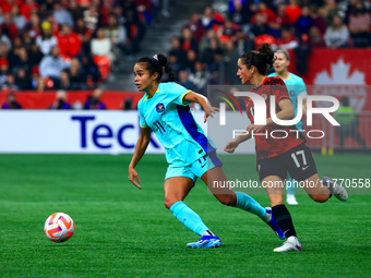 M. Fowler #11 carries the ball while guarded by J. Fleming #17 during the International Friendly Match between Canada and Australia in Vanco...