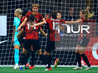 In Vancouver, Canada, on December 5, 2023, Quinn #5 and other Canadian players celebrate a goal during the International Friendly Match betw...