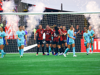 In Vancouver, Canada, on December 5, 2023, Quinn #5 and other Canadian players celebrate a goal during the International Friendly Match betw...